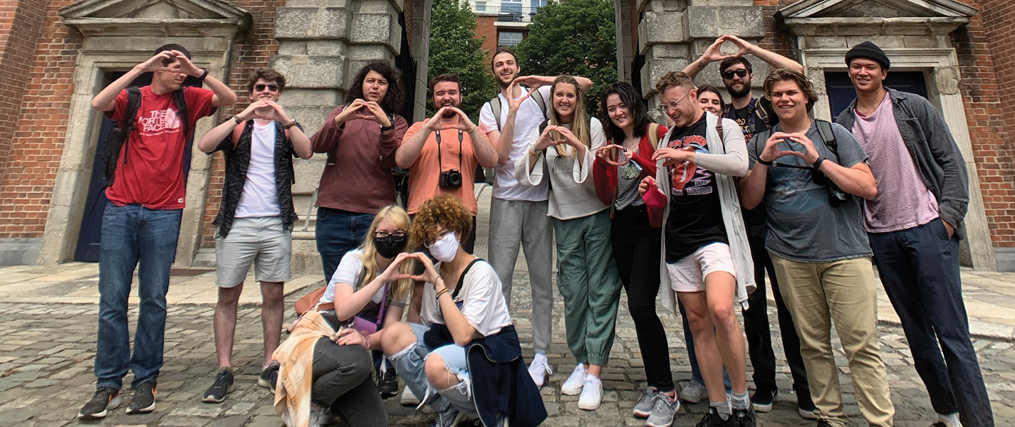Students in front of arch in Ireland